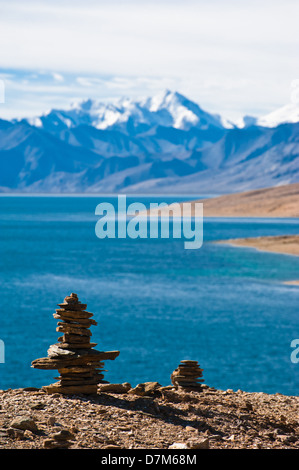 Buddhist stone pyramid at Tso Moriri Lake. Altitude 4600 m. View at Himalaya mountains range with Gya peak 6794 m. India, Ladakh Stock Photo