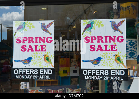 SPRING SALE poster in window of store in city centre of Exeter Devon England UK Stock Photo