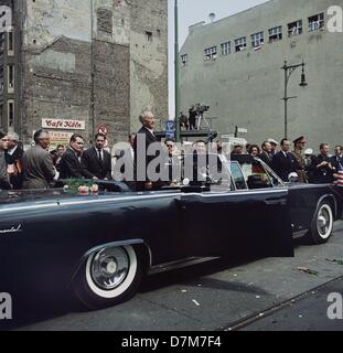 German chancellor Konrad Adenauer standing up in the presidnets Lincoln limousine in which he drove through Berlin on 26 June 1963 with US president John F. Kennedy (not in picture). Stock Photo