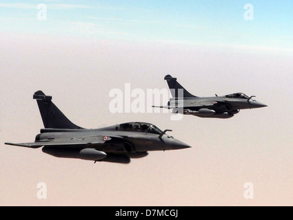 Two French Air Force Rafale fighter aircraft fly in formation as they prepare to take on fuel from a US Air Force KC-135R Stratotanker May 3, 2013, over Mali. Stock Photo