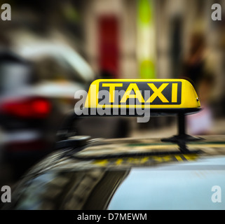 Taxi sign on car in motion blur Stock Photo