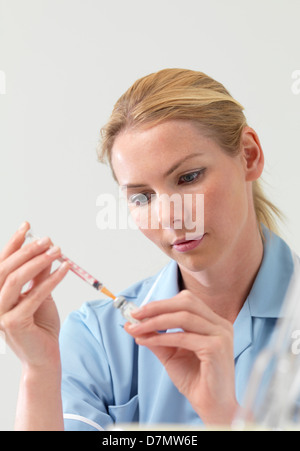 Nurse preparing injection Stock Photo