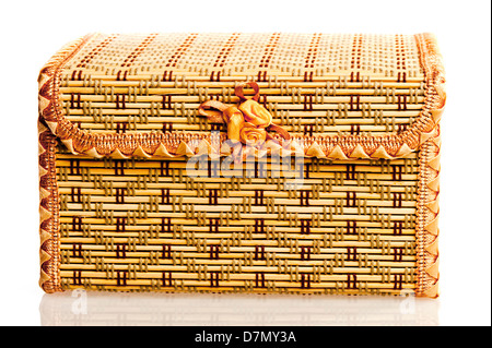 Yellow wicker box for needlework on a white background. Stock Photo