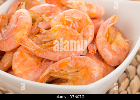 Sauteed Shrimp - Bowl of prawns, shell and tails on. Stock Photo