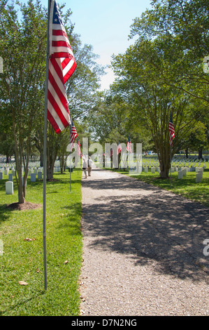 Louisiana, Baton Rouge. National Cemetery, established in 1867. Flag lined walkway. Stock Photo