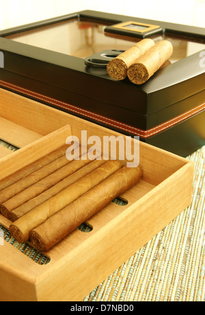 Cuban cigars, black elegant cigar humidor, cigar cutter. Close up. Stock Photo