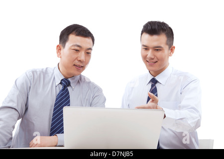 Two business men who use computer Stock Photo