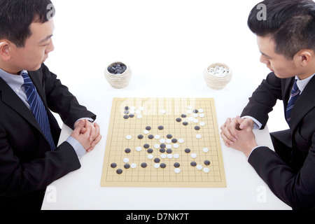 Two business men playing chess Stock Photo