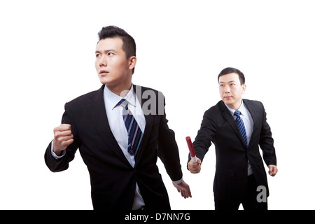 Business people in passing the baton Stock Photo