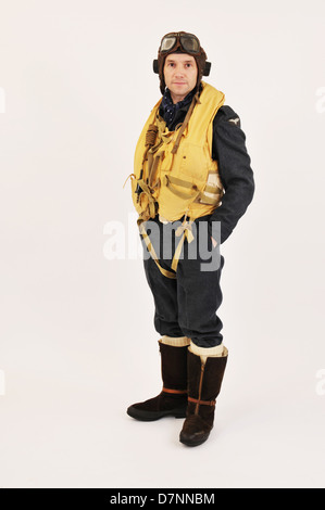 WW2 RAF pilot/crew member wearing flying helmet & 'Mae West' life jacket with hands in pockets. Stock Photo