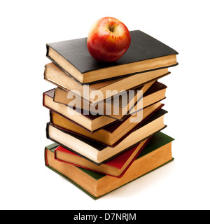 Stack of Old Books With an Apple on Top isolated on white Stock Photo