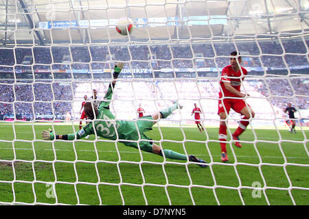 Stuttgart's Vedad Ibisevic scores a 1-0 goal past Schalke's goalkeeper Timo Hildebrand during the German Bundesliga match between FC Schalke 04 and VfB Stuttgart at Veltins-Arena in Gelsenkirchen, Germany, 11 May 2013. Photo: KEVIN KUREK (ATTENTION: EMBARGO CONDITIONS! The DFL permits the further utilisation of up to 15 pictures only (no sequntial pictures or video-similar series of pictures allowed) via the internet and online media during the match (including halftime), taken from inside the stadium and/or prior to the start of the match. The DFL permits the unrestricted transmission of digi Stock Photo