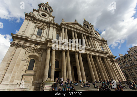 Dynamic distorted view of St Paul cathedral in London, many tourist are sitting on the stairs. Stock Photo