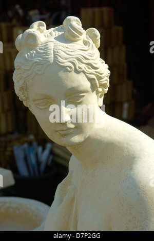 Head and shoulders of a beautiful lady in stone - a garden ornament. Stock Photo