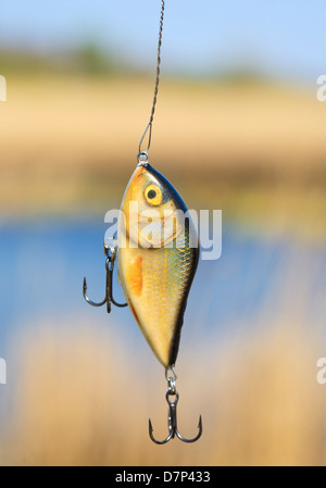 Yellow wobbler. Fishing Lure. Wobbler Popper on Wood Background