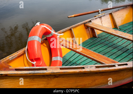 orange life belt in old wooden boat Stock Photo