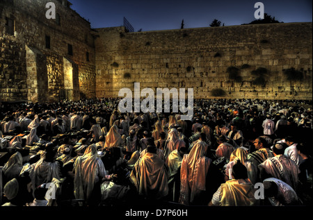 Prayers in the Western Wall at Dusk, Yom Kipur mass Prays, The old city of Jerusalem. Hdr Color Photo. Stock Photo