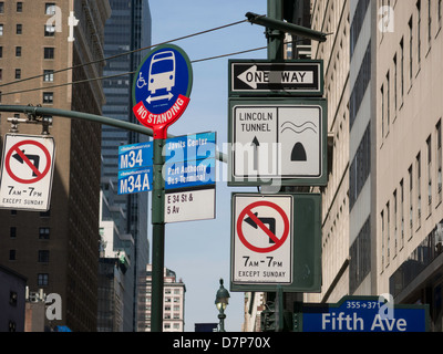 Bus Stop and Traffic Signs, 34th Street, NYC Stock Photo