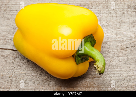 Yellow Bell Pepper on wood Stock Photo