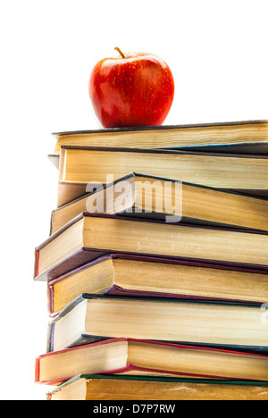 Stack of Old Books With an Apple on Top isolated on white Stock Photo