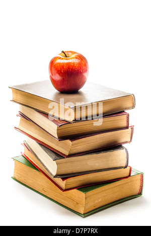 Stack of Old Books With an Apple on Top isolated on white Stock Photo