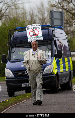 Southport, UK 12th May, 2013. Lone Campaigner and Police OSG at Camp Frack 2 (CampFrack2),  a broad coalition of anti-fracking and environmental groups in the North West including members of Ribble Estuary Against Fracking, Residents’ Action Against Fylde Fracking, Frack Free Fylde, Merseyside Against Fracking, Friends of the Earth and Greater Manchester Association of Trades Union Councils. A weekend of activity in opposition to Fracking and other forms of Extreme Energy. Mar Photographics/Alamy Live News Stock Photo