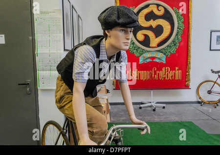 Male mannequin riding historical bicycle at Bicycle Fair in Berlin, Germany Stock Photo