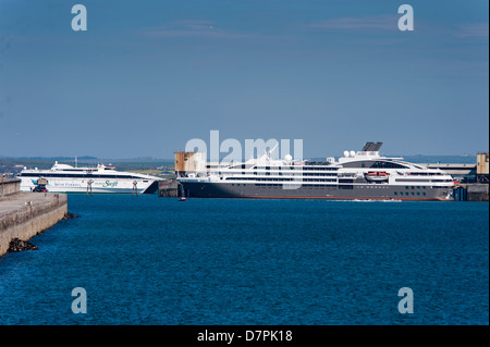 Le Boreal Cruise ship at Holyhead Harbour Anglesey North Wales Uk. And the Jonathon Swift Irish Ferries coming in from Ireland Stock Photo