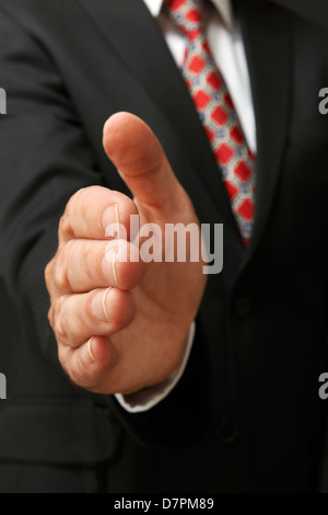 closeup of businessman's hand outstretched for a handshake Stock Photo