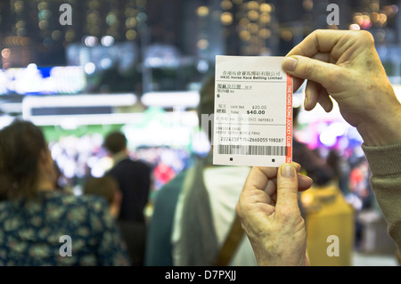 dh Happy Valley racecourse CAUSEWAY BAY HONG KONG Hong Kong racing ticket betting slip night horse races Stock Photo