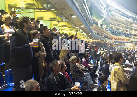 dh Happy Valley racecourse CAUSEWAY BAY HONG KONG Stadium crowd at Hong Kong night race meeting horse racing course Stock Photo