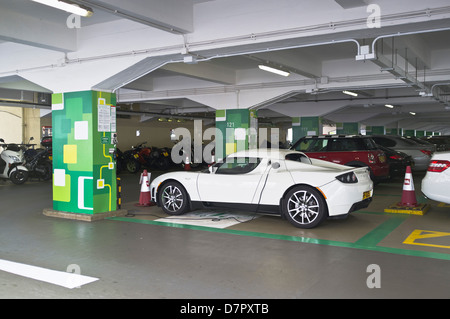 dh Electric charging point TRANSPORT ASIA China Tesla roadster car in Hong Kong carpark charging bay cars station plugged ev charge Stock Photo