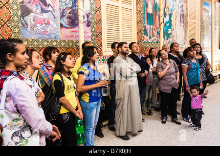 Faithful praying at Mazar Ioannes Coptic mausoleum in Luxor, Egypt Stock Photo