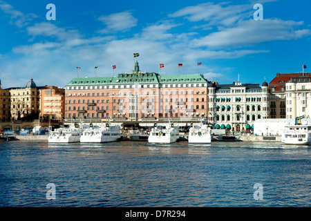 Boats moored outside the Grand Hotel in Stockholm Stock Photo