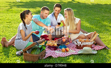 Friends enjoying a healthy picnic Stock Photo