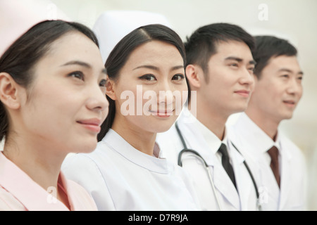 Healthcare workers standing in a row, China Stock Photo