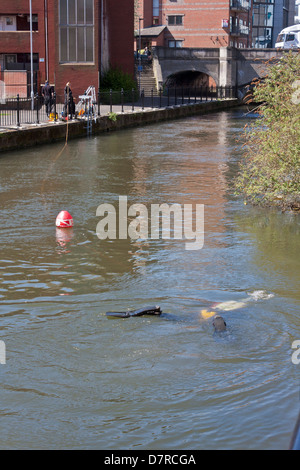A police diver on the surface of the Kennet and Avon Canal in Reading, Berkshire, UK Stock Photo