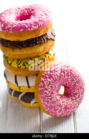 various donuts on kitchen table Stock Photo