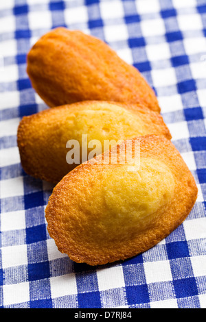 sweet madeleine cookies on table Stock Photo