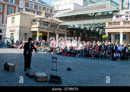 People watching street performance, Covent Garden, London, UK Stock Photo