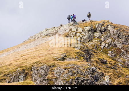 Hikers on the summit of Hopegill Head in the Lake District Stock Photo