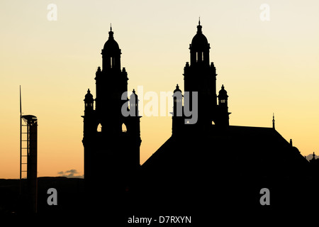 Silhouette of the Victorian Kelvingrove Art Gallery and Museum and contemporary Observation Tower at sunset, Glasgow, Scotland, UK