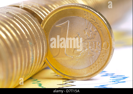 one single euro coin on business chart Stock Photo