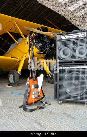 1976 Bicentennial limited edition Gibson Thunderbird bass guitar with Boeing Stearman biplane, Old Buckenham Airfield, Norfolk Stock Photo