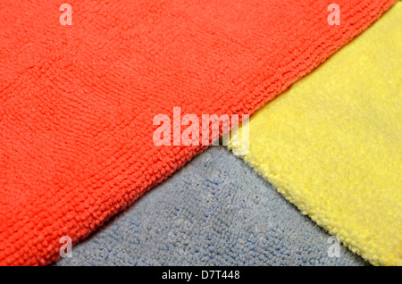 Three colorful microfiber cloths used in cleaning. Stock Photo