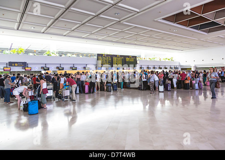 People waiting in line to check in at airport, Lanzarote, Canary Islands, Spain Stock Photo