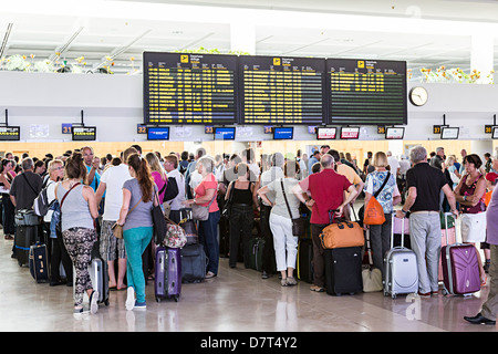 People waiting in line to check in at airport, Lanzarote, Canary Islands, Spain Stock Photo