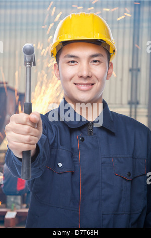 Portrait of Construction Worker with Hammer Stock Photo