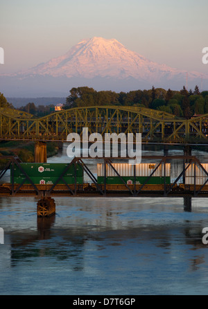 The Puyallup River meanders down from the glaciers on Mount Rainier under bridges through cities on it's way to Puget Sound Stock Photo