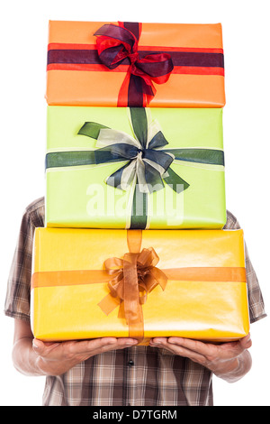 Generous man carrying many gift boxes, isolated on white background Stock Photo